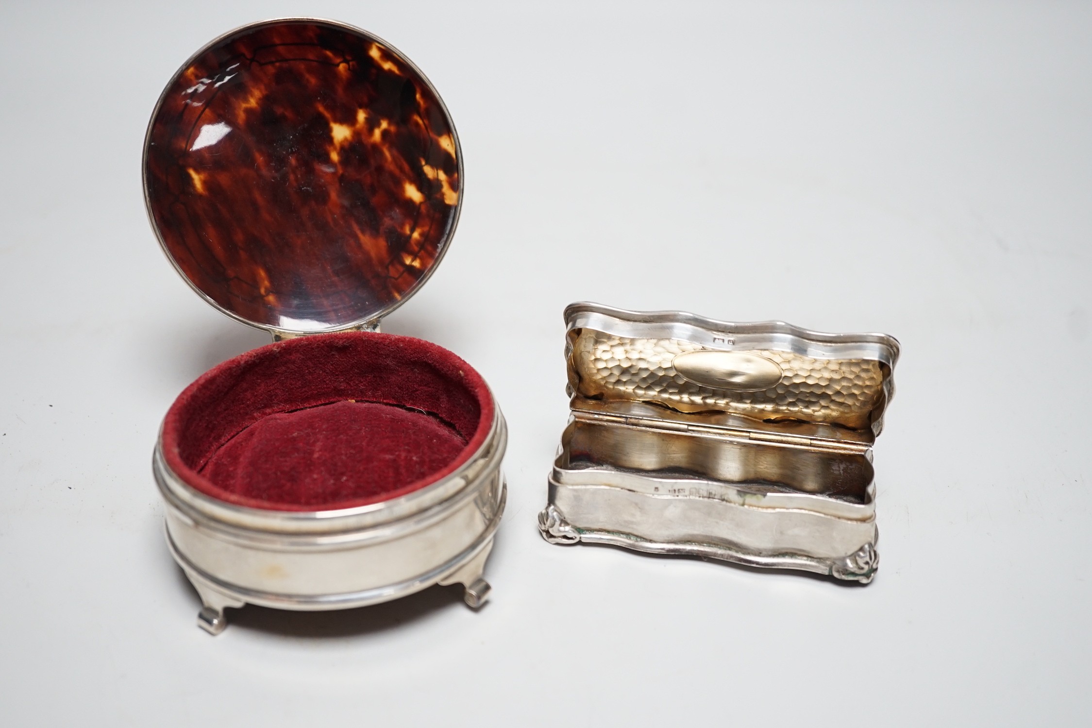 A George V silver and tortoiseshell mounted circular trinket box, Walker & Hall. Birmingham, 1918, 92mm and an earlier silver rectangular trinket box.